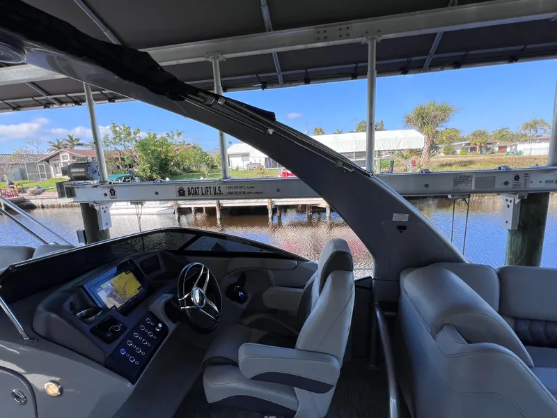 Slide: The Image of Interior of 2021 Bennington QX 27 QFB X2 boat with modern helm and seating. - 37