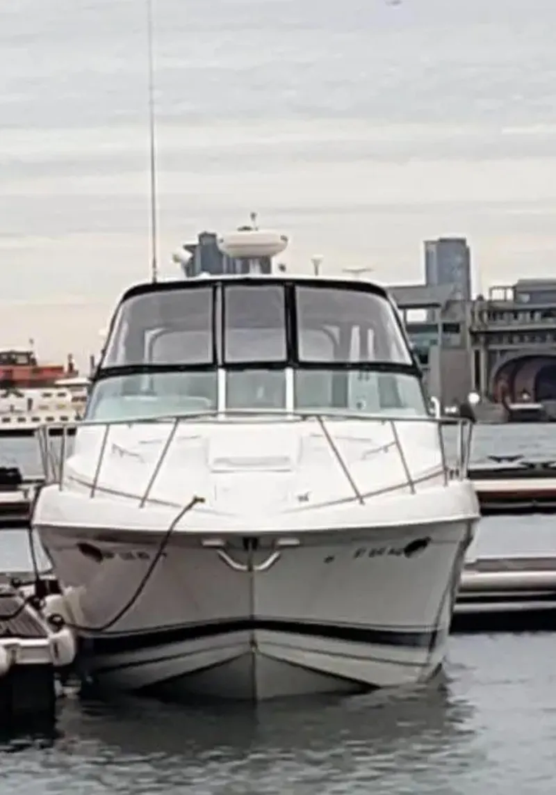 Slide: The Image of 2004 Formula 37 PC yacht docked in marina with cityscape background. - 10
