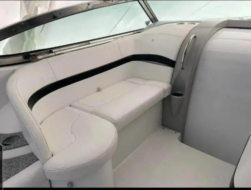 Slide: The Image of 2004 Formula 37 PC boat interior with white seating and sleek design. - 19