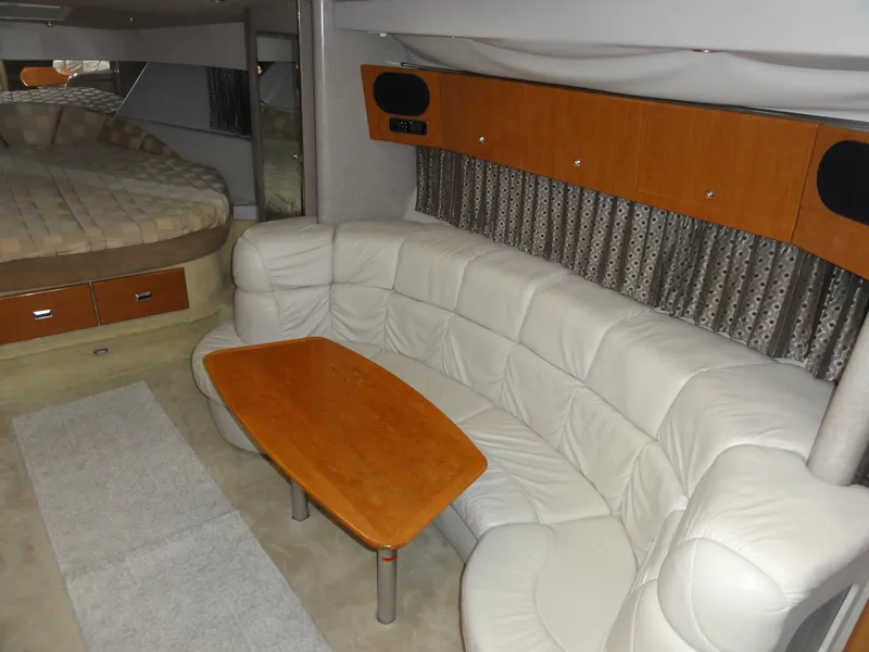 Slide: The Image of 2004 Formula 37 PC yacht interior with leather seating and wooden table. - 27