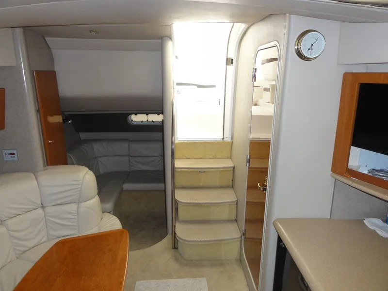 Slide: The Image of 2004 Formula 37 PC yacht interior with stairs, seating, and modern amenities. - 30