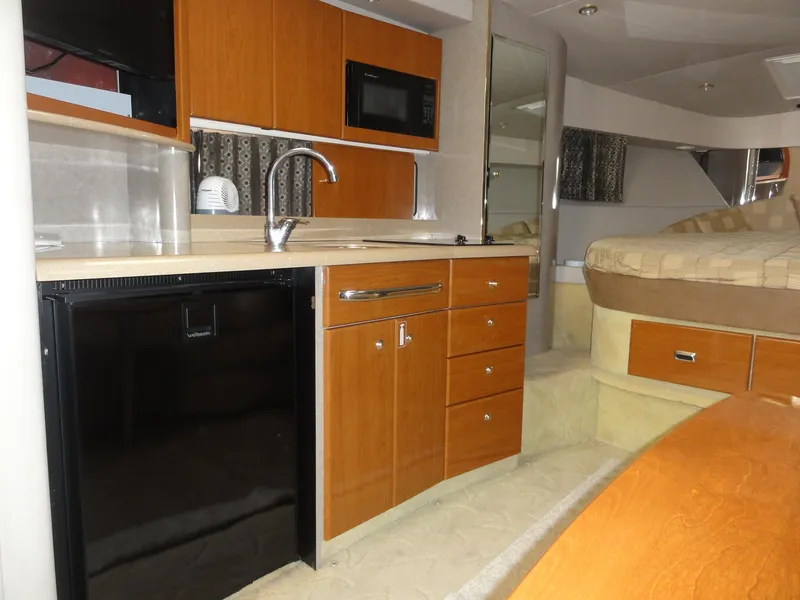 Slide: The Image of 2004 Formula 37 PC yacht interior with kitchenette and bed. - 34