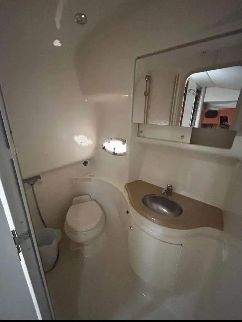 Slide: The Image of 2004 Formula 37 PC yacht bathroom with sink, toilet, and mirror. - 35