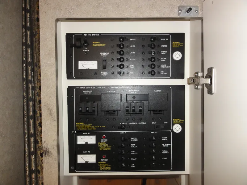 Slide: The Image of Electrical control panel inside a 2004 Formula 37 PC boat, featuring various switches and meters. - 37
