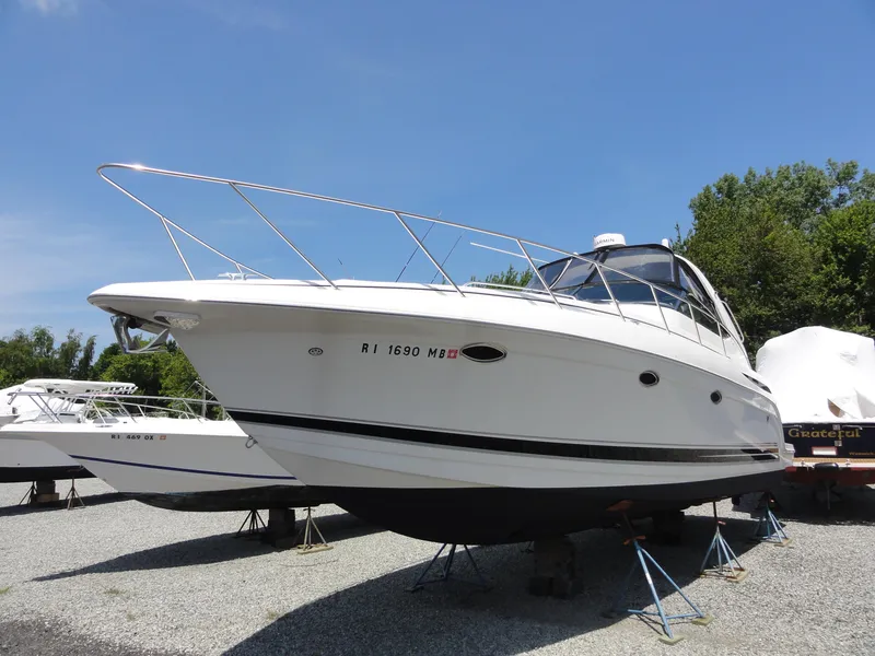 Slide: The Image of 2004 Formula 37 PC boat on stands, clear sky background. - 4