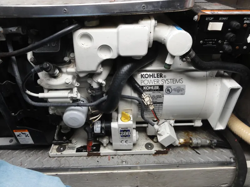 Slide: The Image of Engine compartment of a 2004 Formula 37 PC boat featuring a Kohler power system. - 40