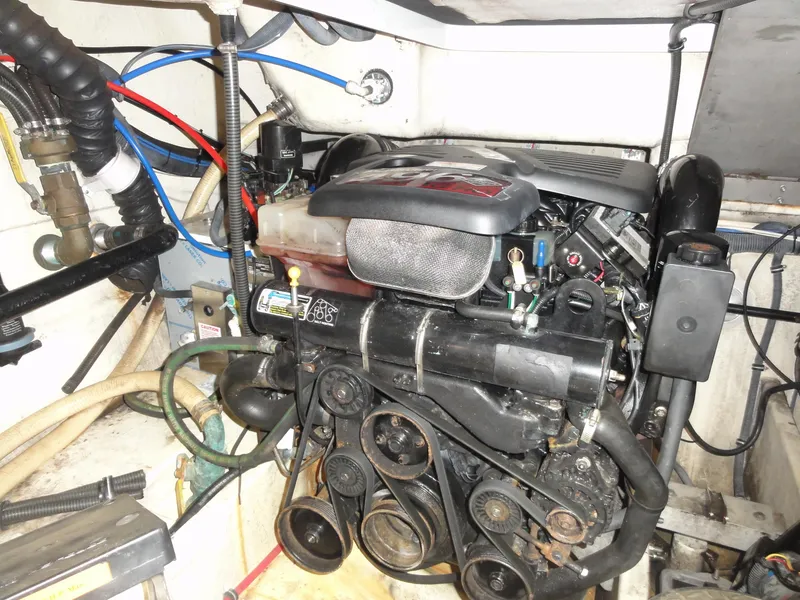 Slide: The Image of Engine compartment of a 2004 Formula 37 PC boat, showcasing mechanical components and wiring. - 42