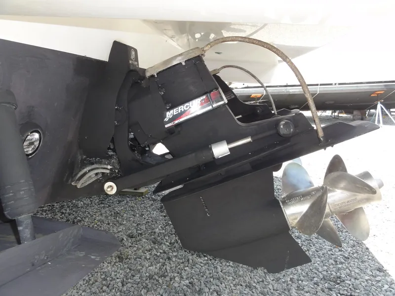 Slide: The Image of 2004 Formula 37 PC boat with MerCruiser outdrive and dual propellers on gravel surface. - 49