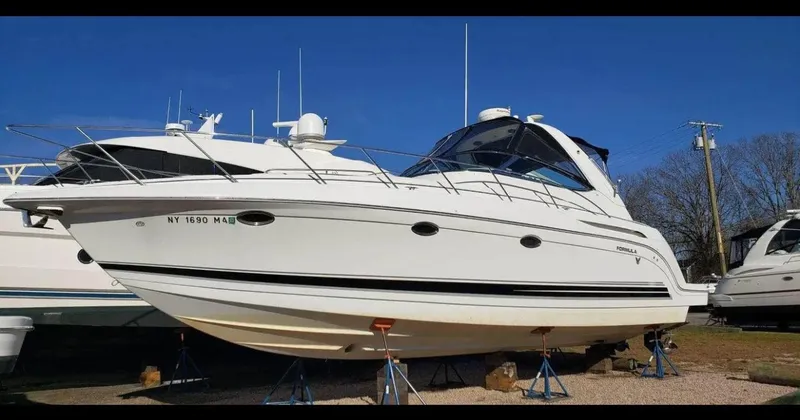 Slide: The Image of 2004 Formula 37 PC yacht on stands, white hull, clear blue sky background. - 5