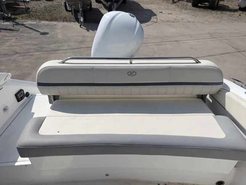 Slide: The Image of 2020 Cobalt 25SC boat seating area with cushioned bench and backrest. - 9