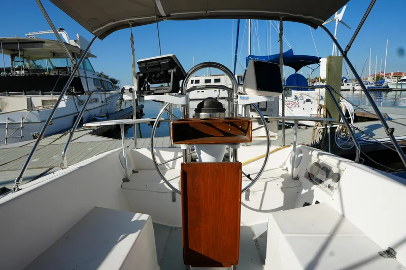 Slide: The Image of Cockpit of a 1990 Catalina 28 sailboat docked at a marina. - 8