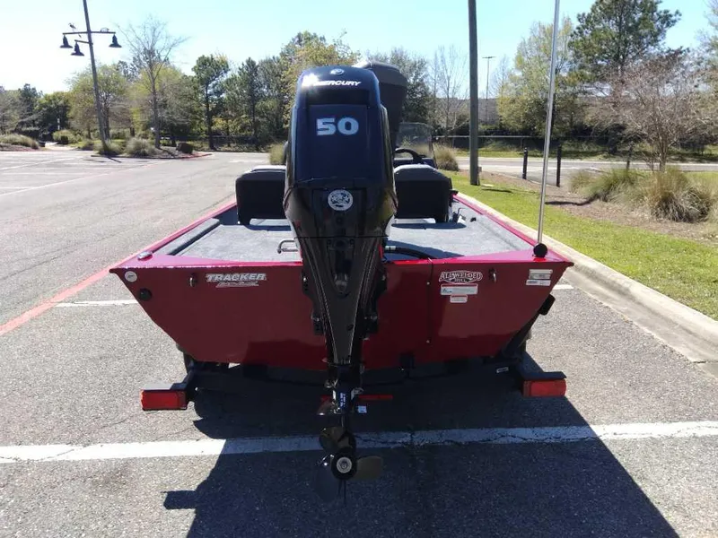 Slide: The Image of 2025 Tracker Bass Tracker Classic XL boat with Mercury 50 engine in parking lot. - 2