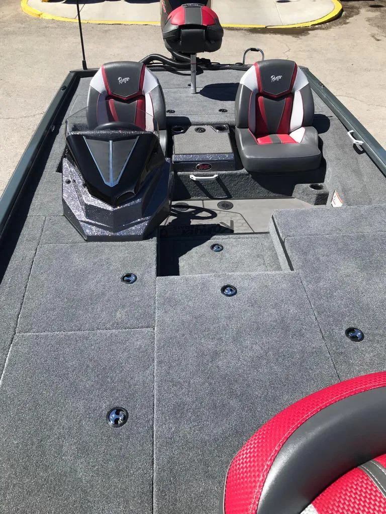 Slide: The Image of 2025 Ranger ALPHA 208 boat interior with dual seats and modern dashboard. - 11