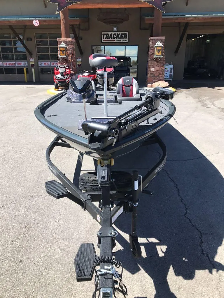 Slide: The Image of 2025 Ranger ALPHA 208 fishing boat on trailer, parked outside a dealership. - 3