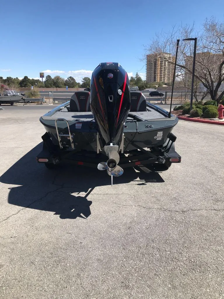 Slide: The Image of 2025 Ranger ALPHA 208 boat, rear view, parked outdoors on a sunny day. - 9