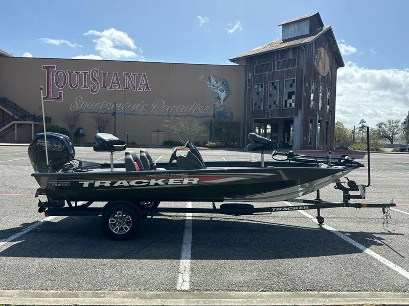 Slide: The Image of 2025 Tracker Pro Team 190 boat parked in front of Louisiana Sportsman's Paradise building. - 2