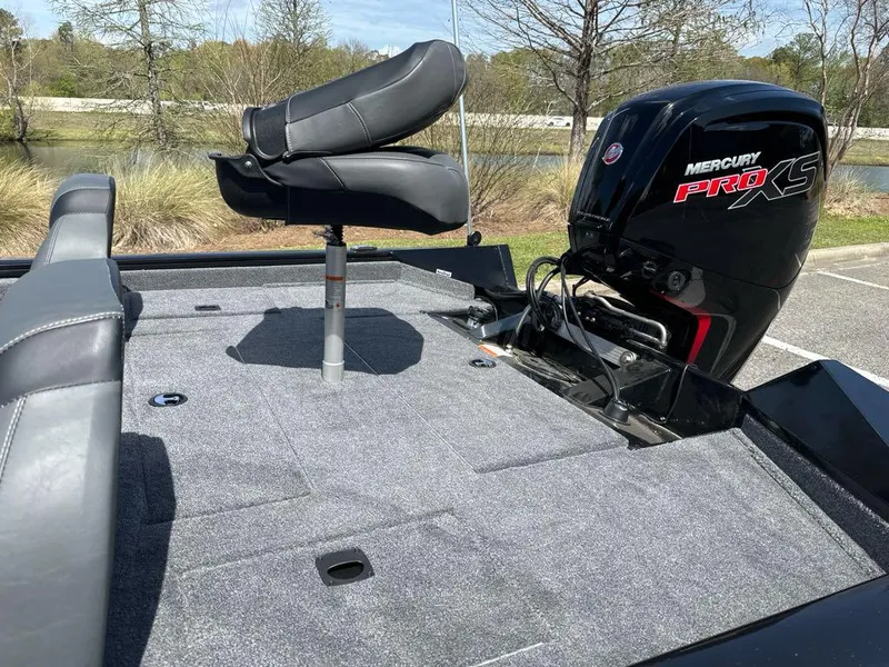 Slide: The Image of 2025 Tracker Pro Team 190 boat with Mercury Pro XS engine, featuring a comfortable seating area. - 6
