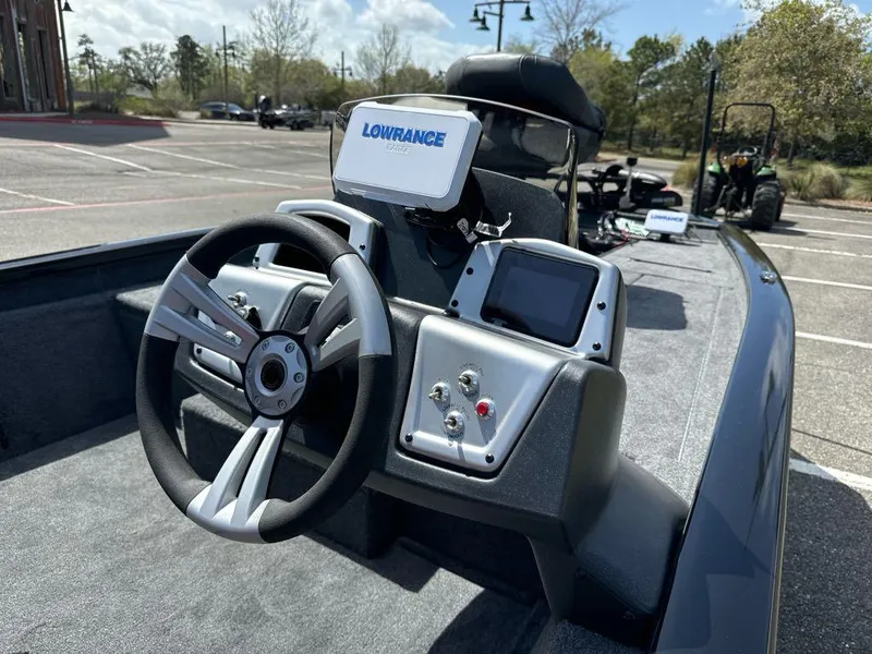 Slide: The Image of 2025 Tracker Pro Team 190 boat dashboard with steering wheel and Lowrance electronics. - 7
