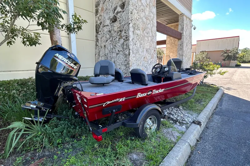 The Image of 2025 Tracker Bass Tracker Classic XL boat with Mercury engine, parked outdoors. - 0