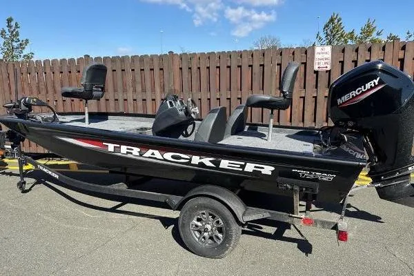 The Image of 2025 Tracker Pro Team 175 Crappie Edition boat with Mercury engine, parked outdoors. - 0