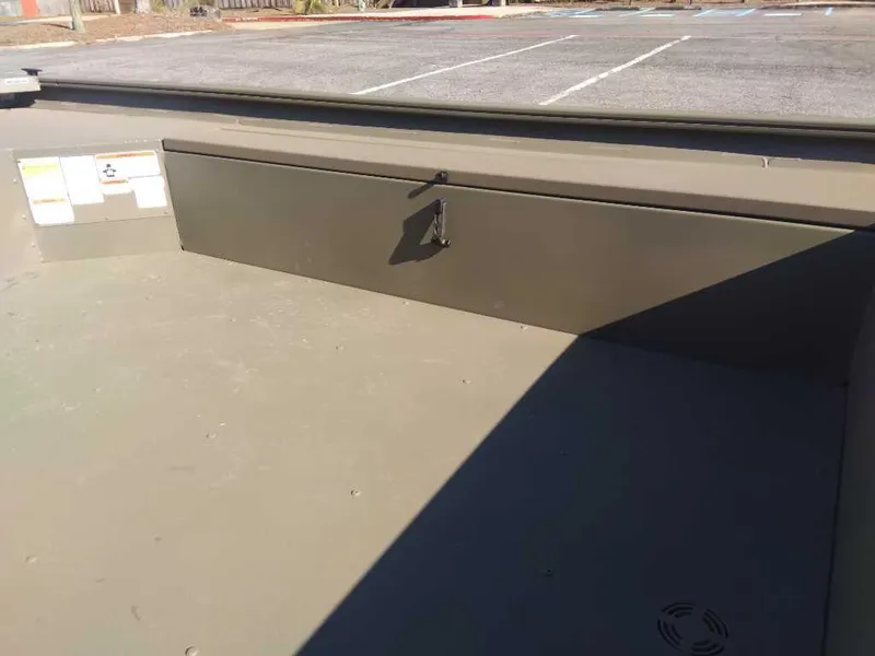 Slide: The Image of 2025 Tracker Grizzly 1654 T Sportsman boat interior with storage compartment. - 10