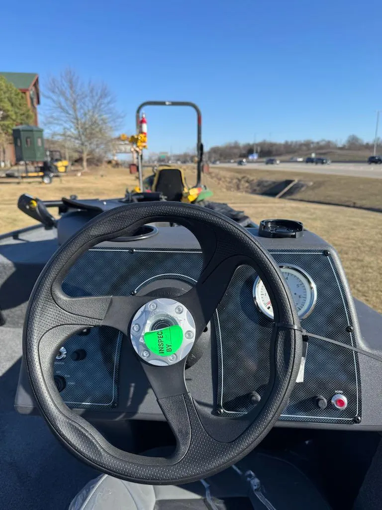 Slide: The Image of 2025 Tracker Bass Tracker Classic XL steering wheel and dashboard on a sunny day. - 8