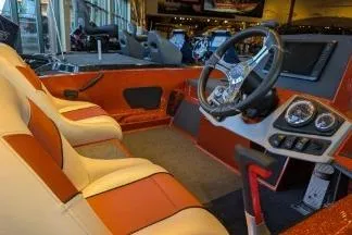 Slide: The Image of 2025 Ranger Z185 boat interior with modern dashboard and seating. - 2