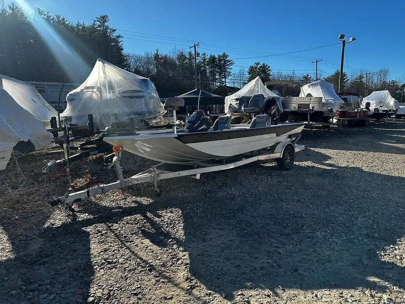 Slide: The Image of 2025 Avid 18 Vertex boat on trailer in outdoor storage lot. - 1
