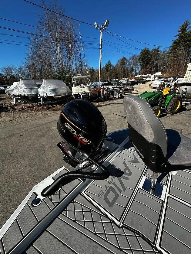 Slide: The Image of 2025 Avid 18 Vertex boat with motor, parked outdoors on a sunny day. - 3