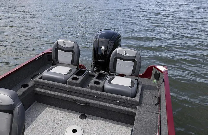 Slide: The Image of 2025 Lowe FM 1775 WT boat with dual seats on a calm lake. - 3