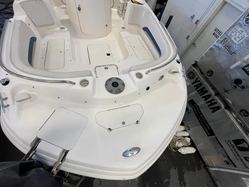 Slide: The Image of Godfrey FD211 boat deck, 2005 model, with Yamaha equipment in a garage setting. - 20