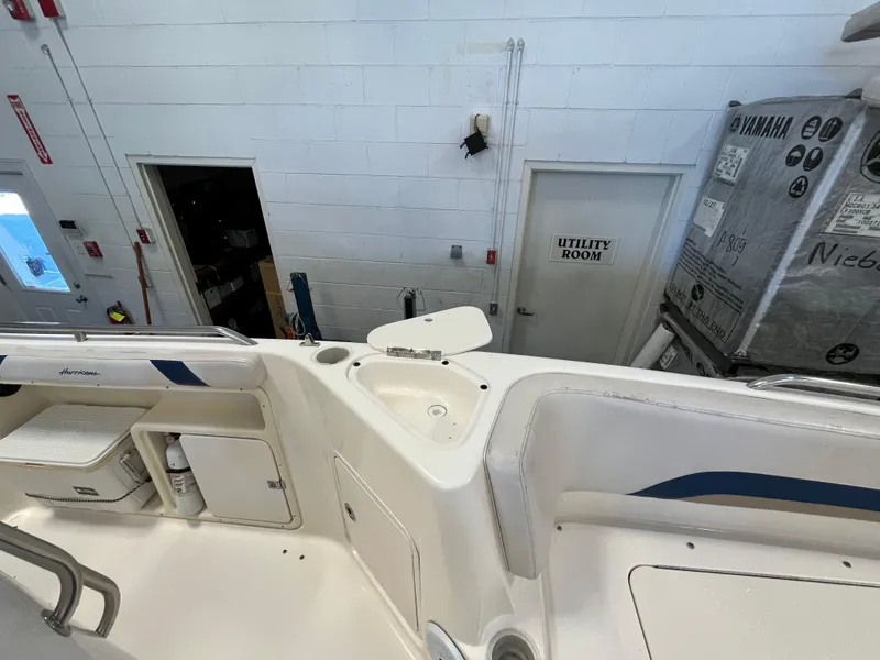 Slide: The Image of 2005 Godfrey FD211 boat interior with utility room and storage compartments. - 27