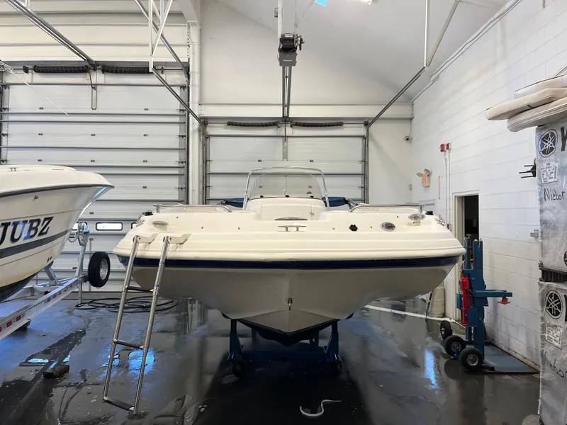 Slide: The Image of 2005 Godfrey FD211 boat in indoor storage facility. - 3