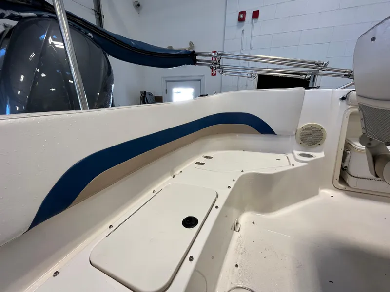 Slide: The Image of Interior view of a 2005 Godfrey FD211 boat, featuring seating and storage compartments. - 31