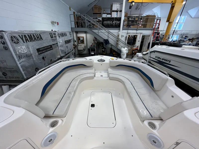 Slide: The Image of Interior view of a 2005 Godfrey FD211 boat in a workshop setting. - 40