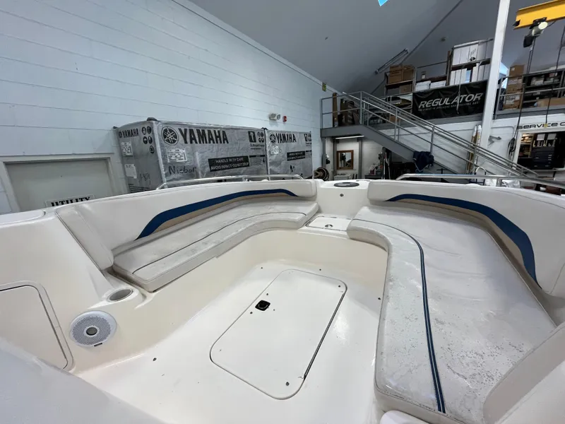 Slide: The Image of Interior of a 2005 Godfrey FD211 boat with spacious seating and storage. - 42