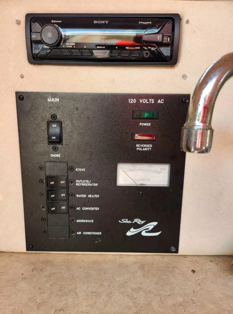 Slide: The Image of Control panel of a 2001 Sea Ray 240 Sundancer boat with Sony stereo system. - 13