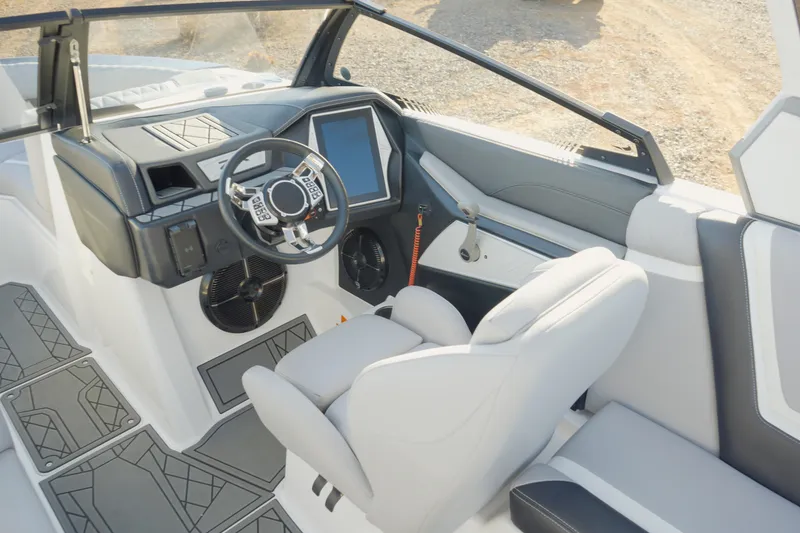 Slide: The Image of 2020 Tigé 25ZX boat interior with modern dashboard and steering wheel. - 5