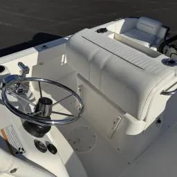 Slide: The Image of 2007 Boston Whaler 190 Outrage boat interior with steering wheel and seating. - 10
