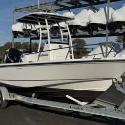 Slide: The Image of 2007 Boston Whaler 190 Outrage boat on trailer, parked outdoors. - 11