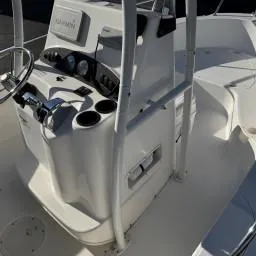 Slide: The Image of 2007 Boston Whaler 190 Outrage boat console with steering wheel and controls. - 12
