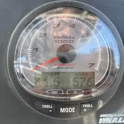 Slide: The Image of Close-up of a 2007 Boston Whaler 190 Outrage tachometer displaying RPM, volts, and hours. - 15