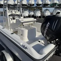 Slide: The Image of 2007 Boston Whaler 190 Outrage boat with Mercury engine, docked in storage facility. - 5