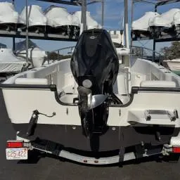 Slide: The Image of 2007 Boston Whaler 190 Outrage boat on trailer, rear view with outboard motor. - 6