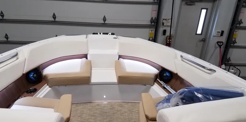 Slide: The Image of 2019 Cobalt 25SC boat interior with beige seating and modern design. - 11