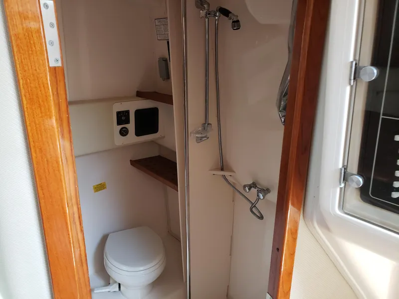 Slide: The Image of 2007 Grady-White Express 360 boat bathroom with shower and toilet. - 11