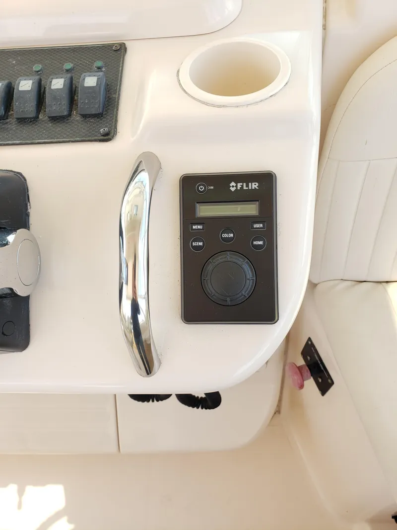 Slide: The Image of 2007 Grady-White Express 360 boat control panel with FLIR system. - 12