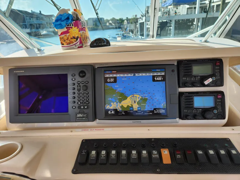 Slide: The Image of 2007 Grady-White Express 360 dashboard with navigation and control systems. - 5