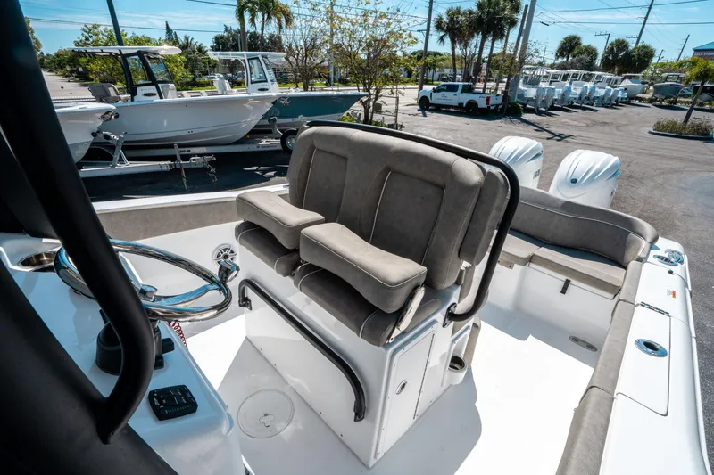 Slide: The Image of 2025 Sea Hunt Ultra 265 SE boat interior with seating and dual engines. - 26