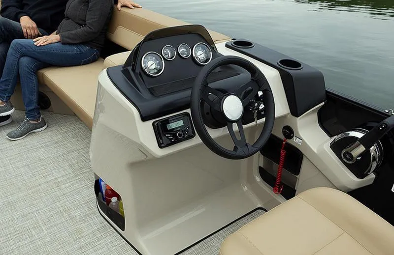 Slide: The Image of 2025 Lowe LS170 boat interior with steering wheel and dashboard controls. - 1